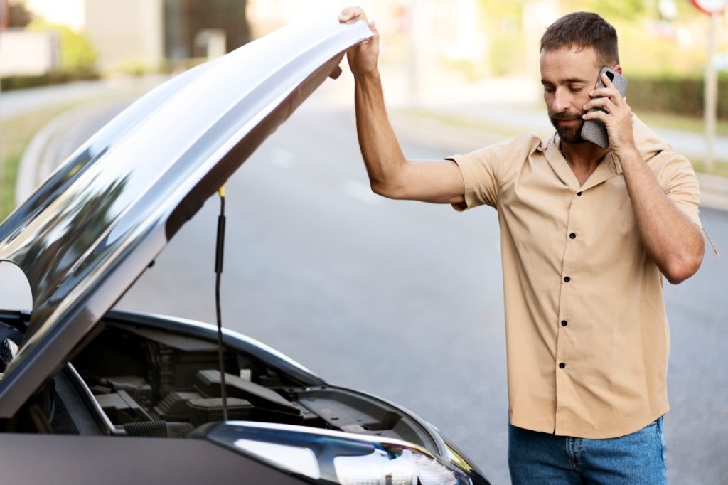 Person having car trouble