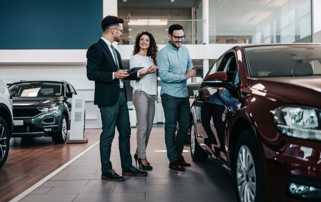 people at a car dealership