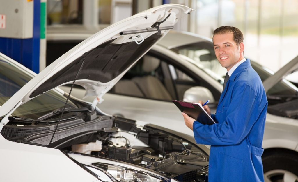 Man inspecting engine