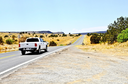 Truck driving down the road